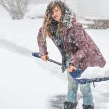 woman shoveling snow