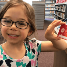 girl with library card