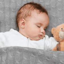 baby sleeping with favorite toy