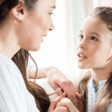 girl focused on mom