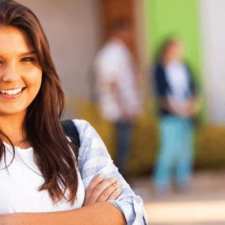 smiling girl crossing arms