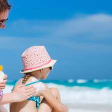 mother applying sun screen