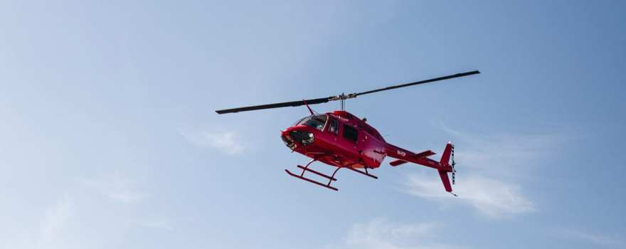 helicopter flying over house