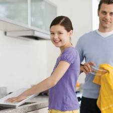 child doing chores with dad