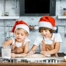 kids in santa hats cook