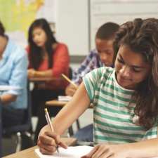 girl working hard in school