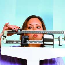 woman weighing herself