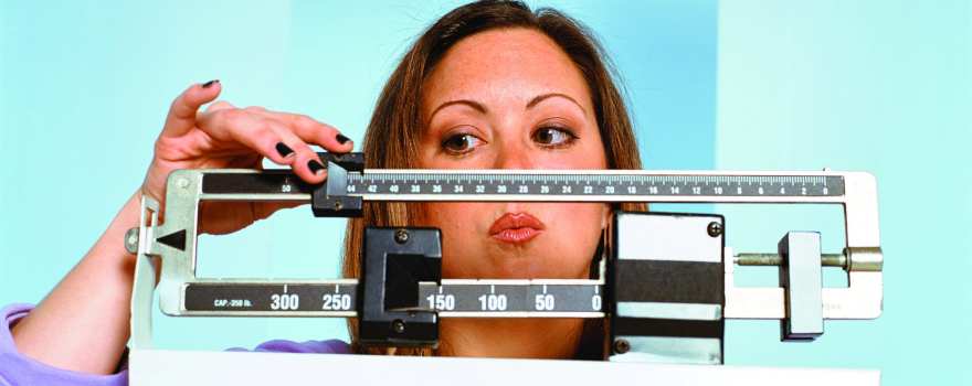 woman weighing herself