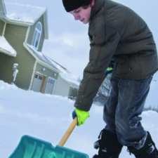 boy shoveling snow in staten island