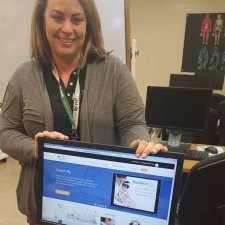 teacher with computer monitor