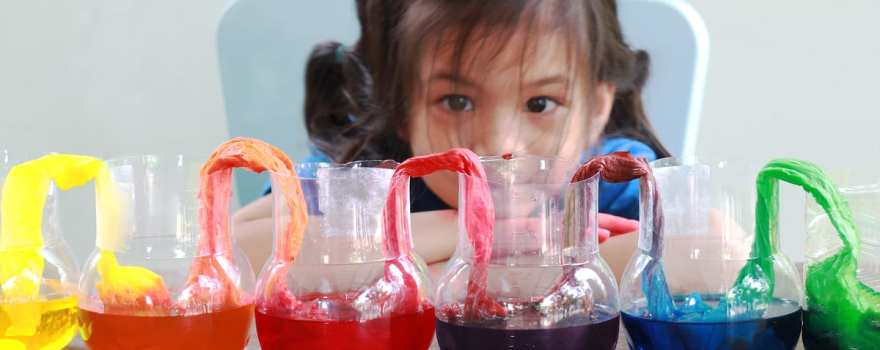 kid doing science experiment