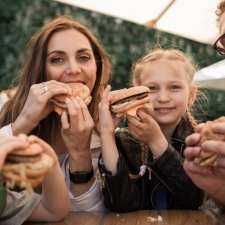 family enjoying hamburgers