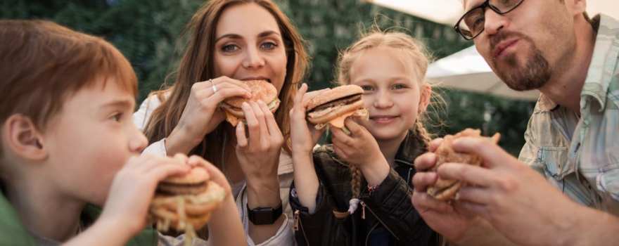 family enjoying hamburgers