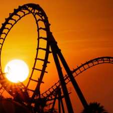 roller coaster tracks at sunset