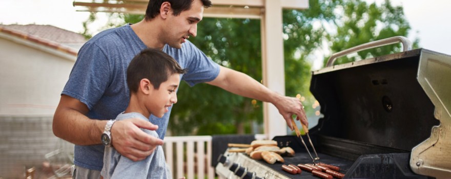 father and son grilling