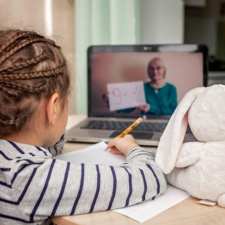 young girl learning math on zoom