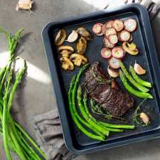 steak with mushrooms, turnips, garlic and asparagus