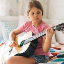 girl playing guitar