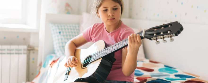 girl playing guitar