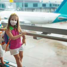 Kids in masks at airport