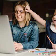 Girl pulls mom's glasses off when she's working from home