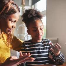 Mom helping child with homework