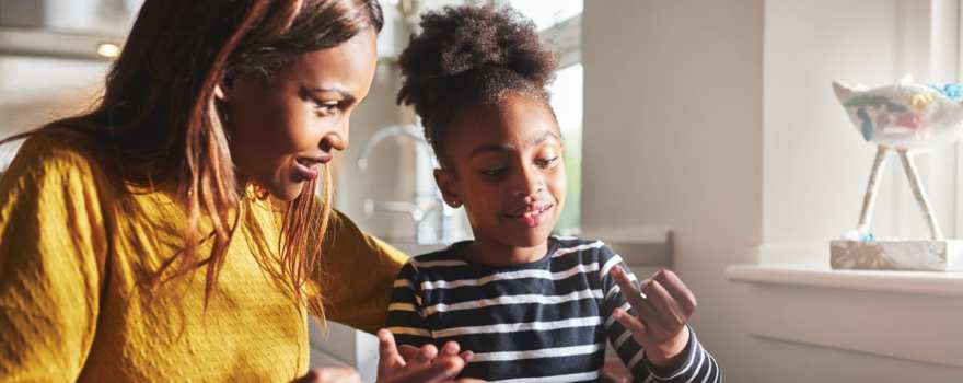 Mom helping child with homework