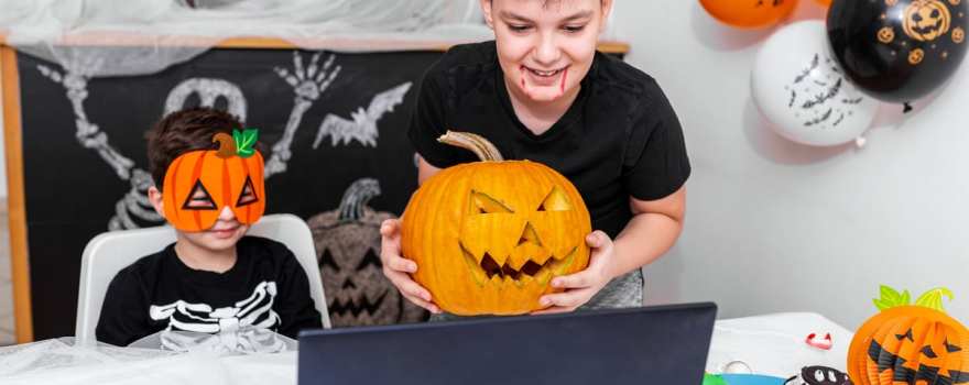 Boy showing pumpkin to virtual camera