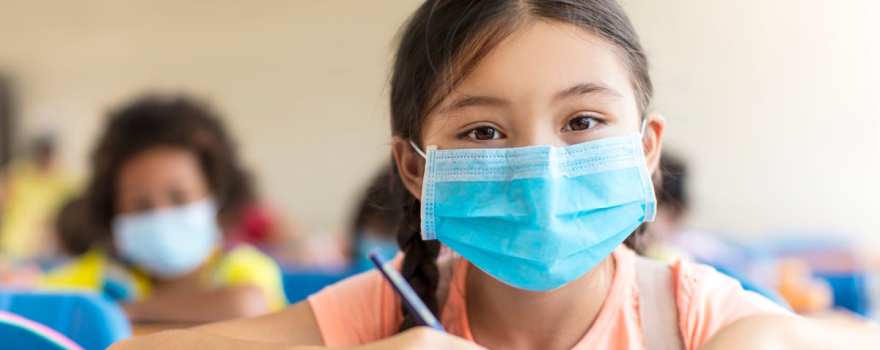 Girl in mask in school