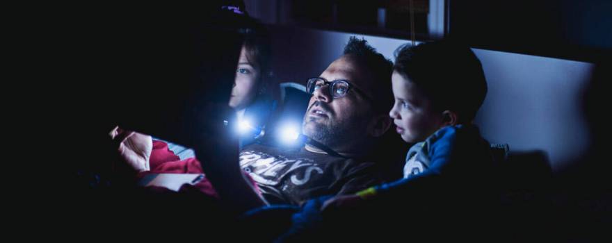 father reading to children