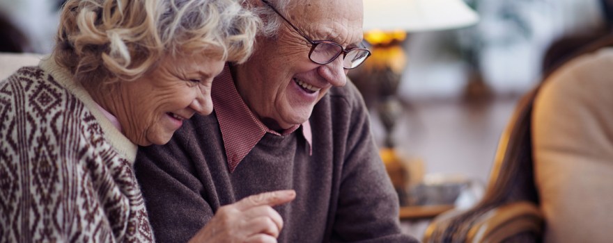 Elderly couple using tablet