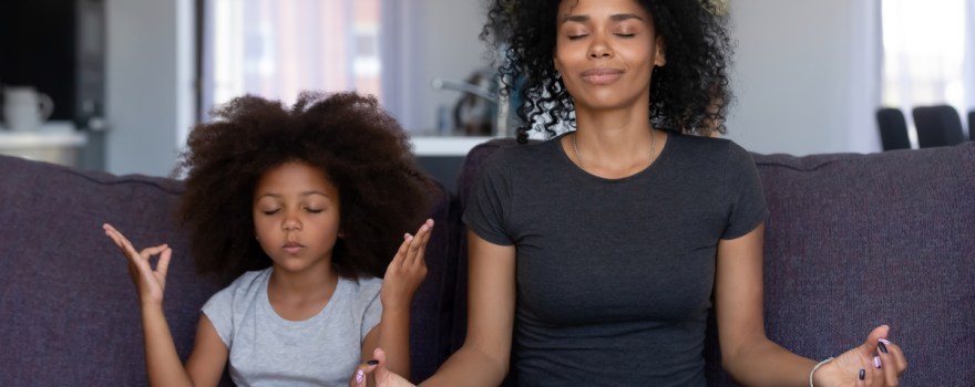 mom and daughter meditating