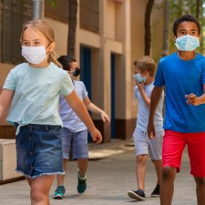 kids in masks walking