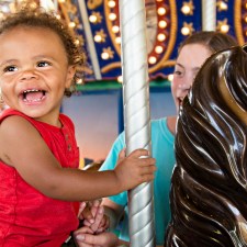 kid on carousel