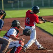 baseball players at home plate