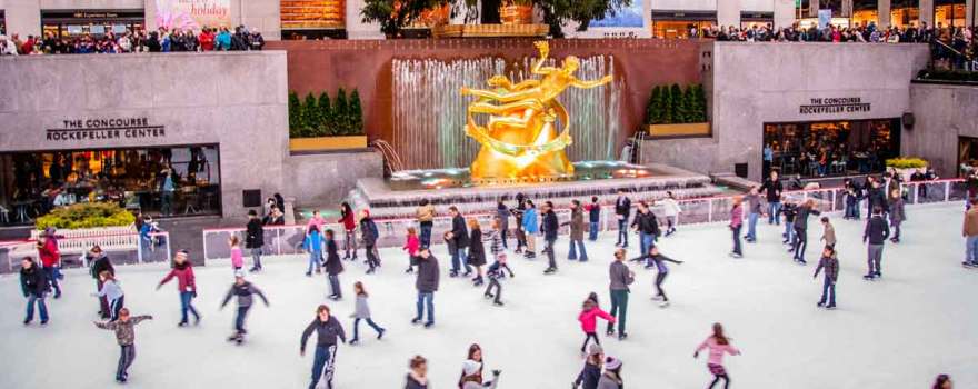 people ice skating at the rink at rockefeller center