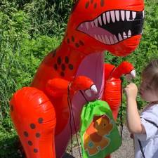 child with speech/language disability interacting with dinosaur