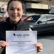 teenager holding a certificate