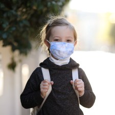 child wearing mask outside