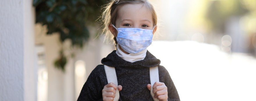 child wearing mask outside