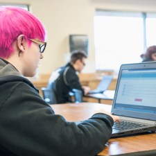 student at a laptop