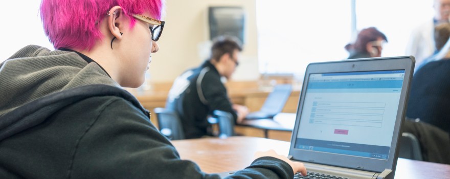 student at a laptop