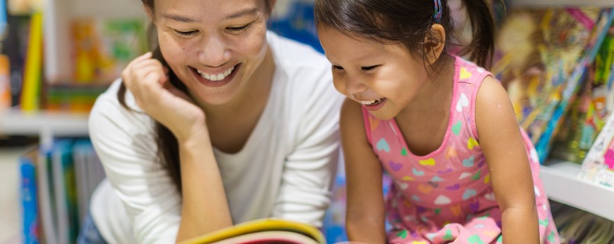 woman and little girl reading