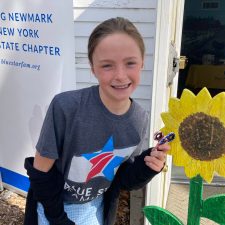 little girl with a dandelion prop