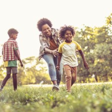 African American family having fun outdoors.