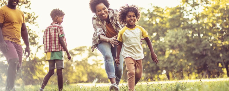 African American family having fun outdoors.