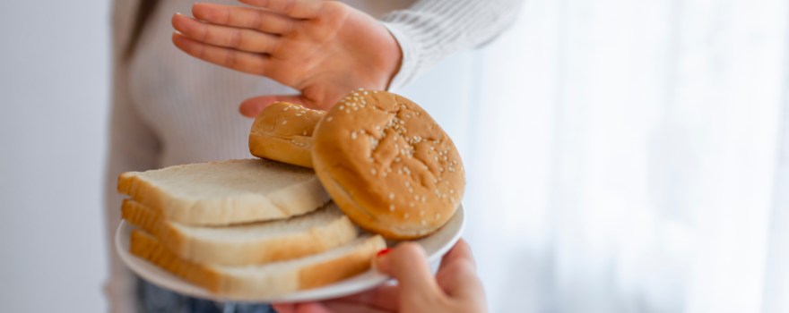 teen avoiding a plate of bread