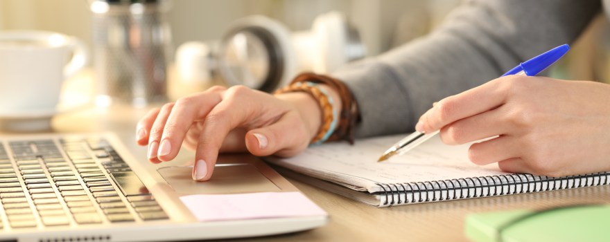 close-up of hands at a laptop