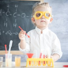 child doing science experiments