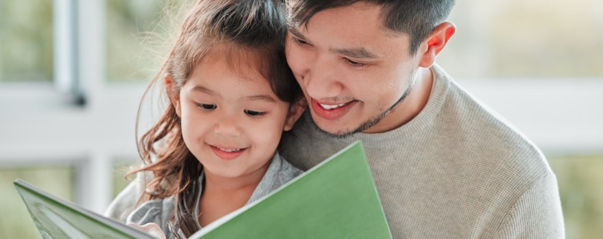 father and daughter reading to improve reading skills